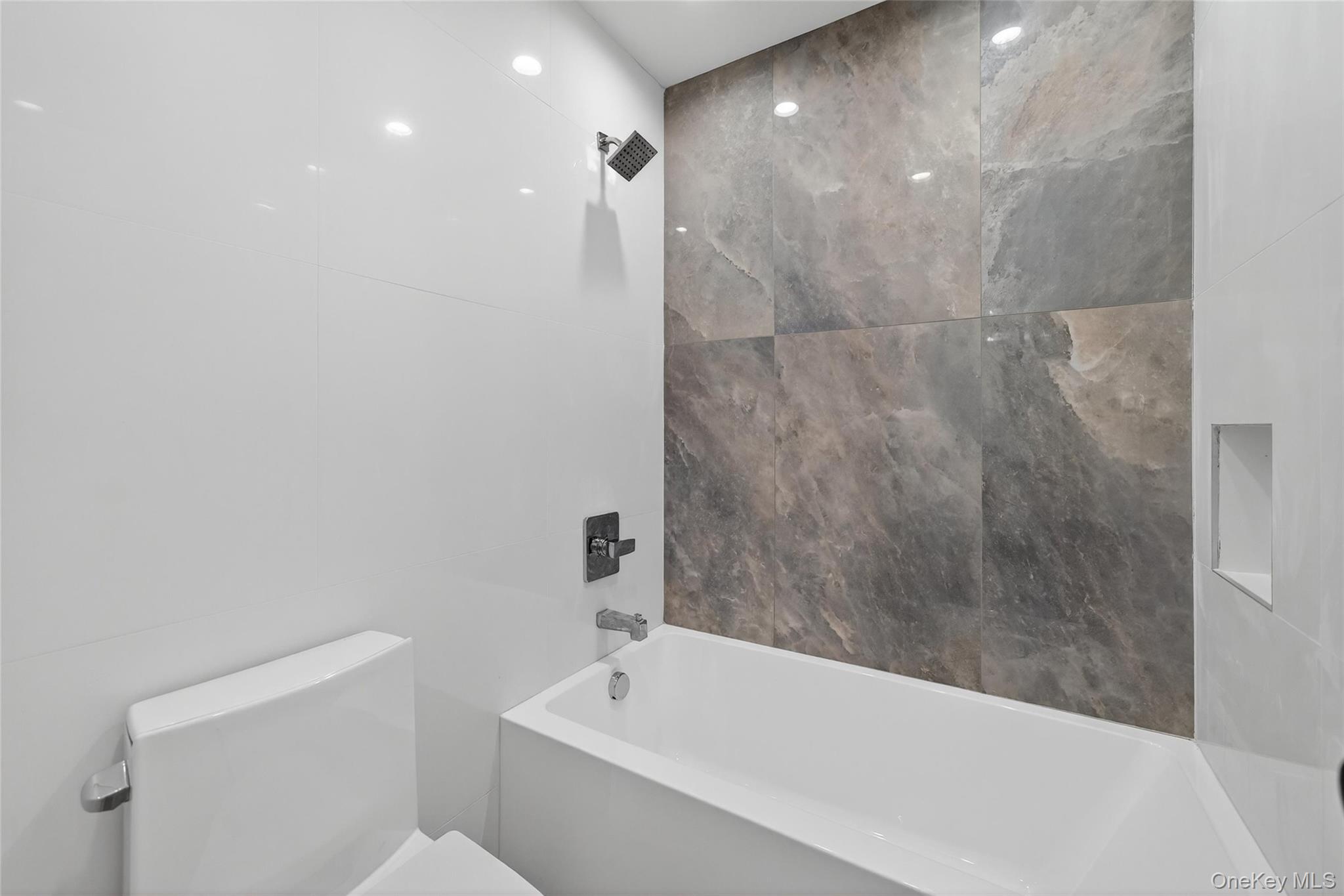 12 East Dillon Road, Unit 202 Monticello, NY 12701 - Photo 29 of 44 a bathroom with a bathtub and toilet