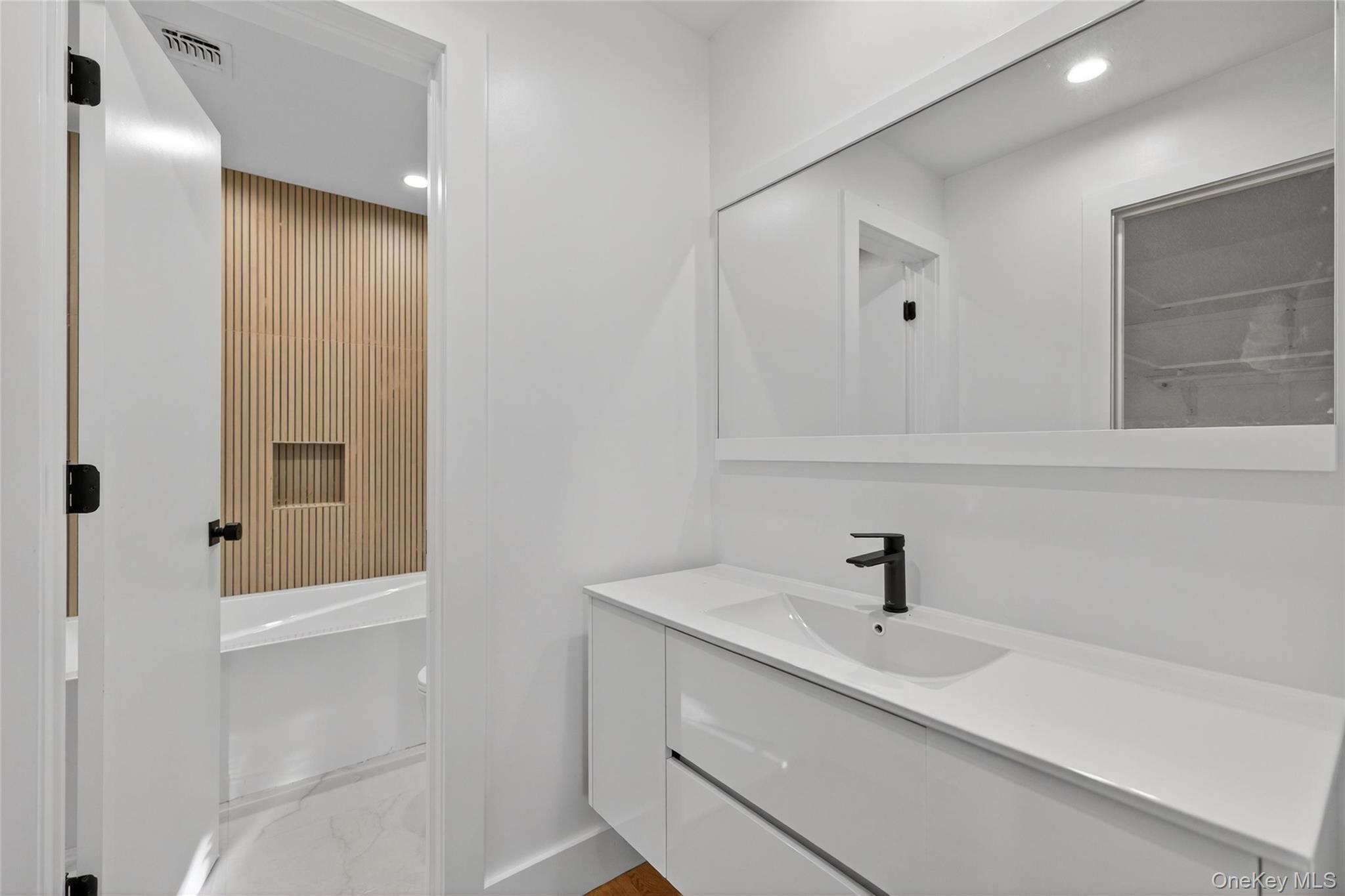 12 East Dillon Road, Unit 202 Monticello, NY 12701 - Photo 34 of 44 a bathroom with a sink and a mirror