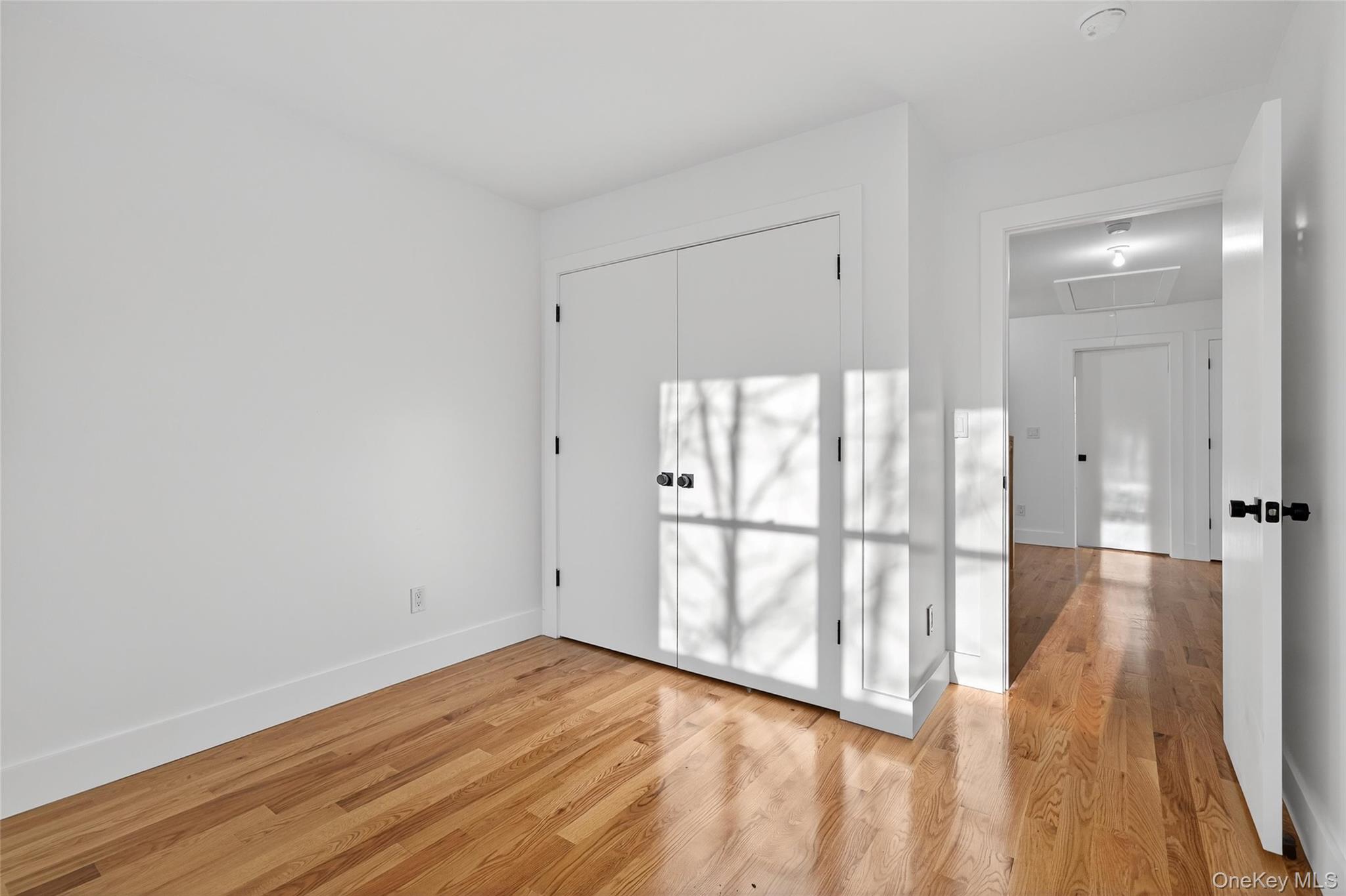 12 East Dillon Road, Unit 202 Monticello, NY 12701 - Photo 37 of 44 a view of empty room with wooden floor