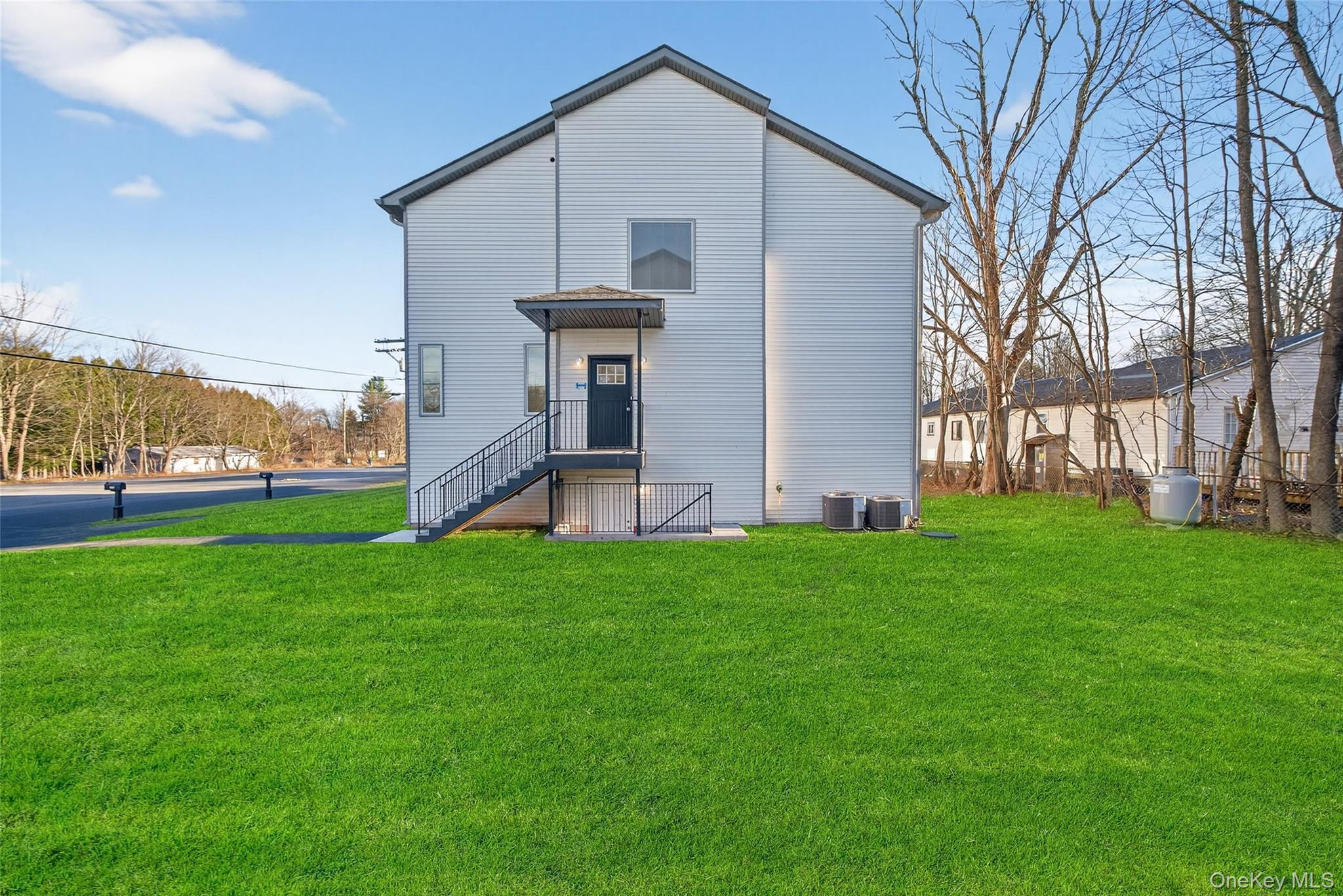 12 East Dillon Road, Unit 202 Monticello, NY 12701 - Photo 8 of 44 a front view of house with garden