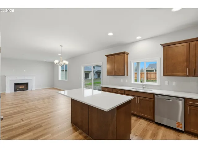 a kitchen with a sink and wooden cabinets