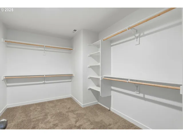 a view of an empty walk in closet