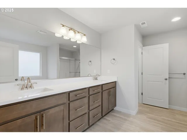 a bathroom with a sink vanity and a mirror