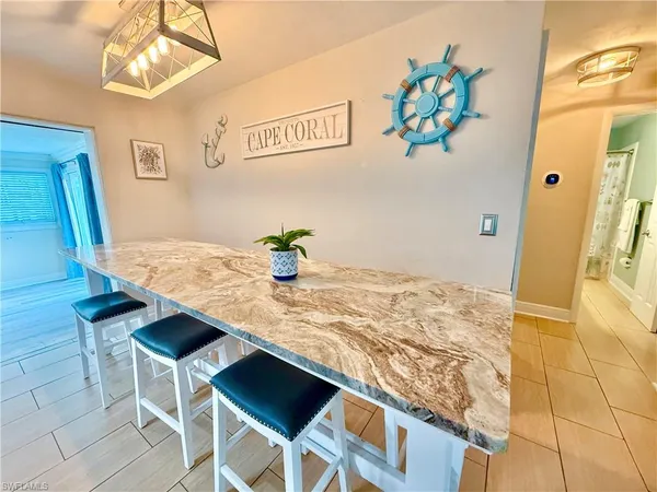 a kitchen with a table and chairs in it