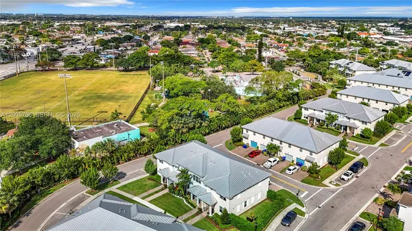 an aerial view of a house with yard swimming pool and outdoor seating