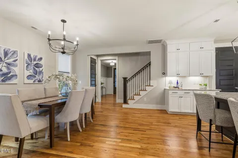 a kitchen with stainless steel appliances granite countertop a refrigerator a stove a sink and a refrigerator