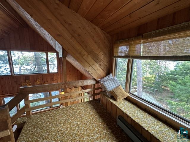 2763 Van Vac Road Ely, MN 55731 - Photo 18 of 37 Sloped wood-paneled ceilings with exposed beams