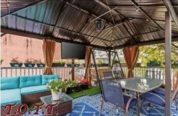 a view of a porch with furniture and a backyard