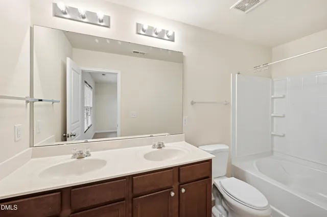 a bathroom with a sink a toilet and a bathtub