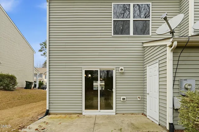 a view of a house with a door and a window