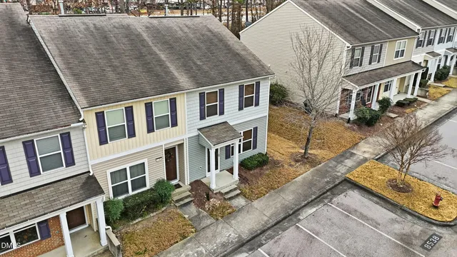 a aerial view of a house with a yard and sitting space