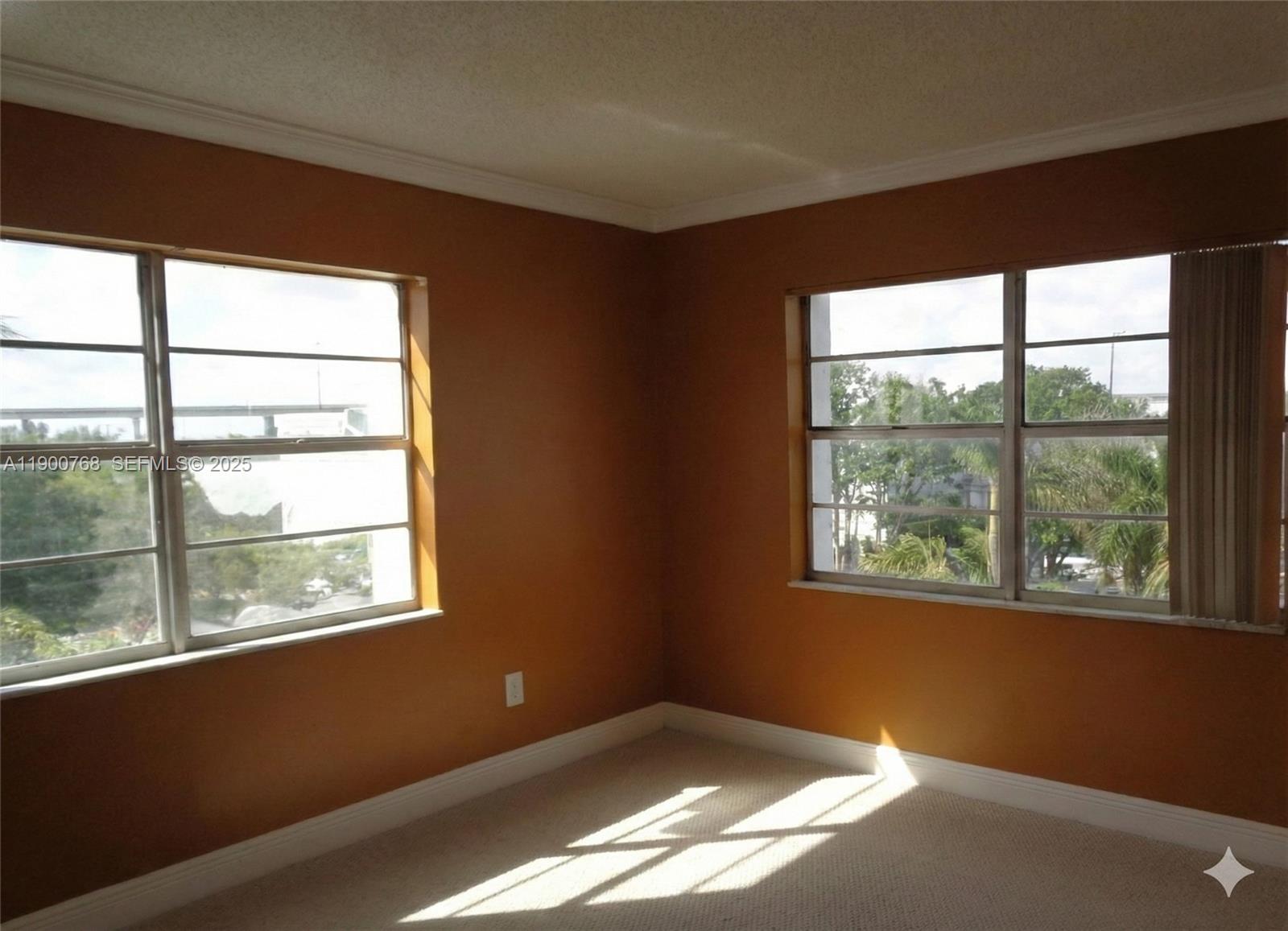 494 Northwest 165th Street, Unit C602 Miami, FL 33169 - Photo 11 of 12 a view of an empty room with a window