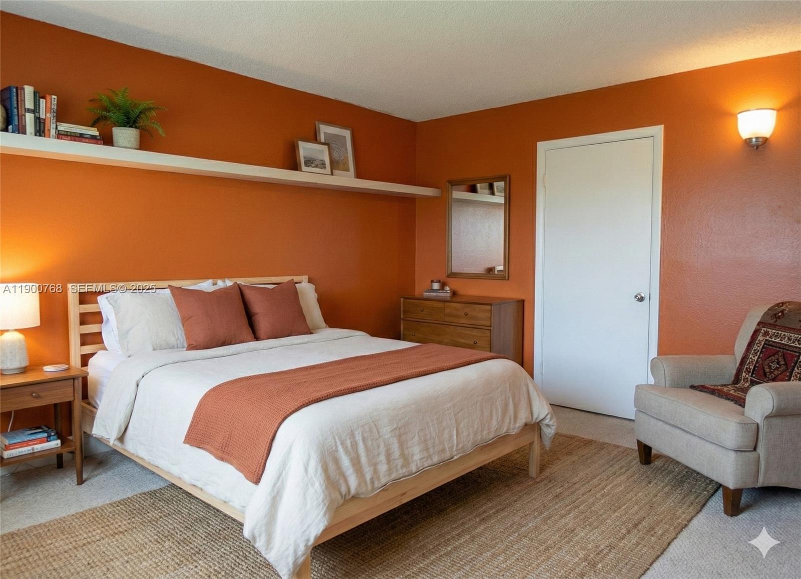 494 Northwest 165th Street, Unit C602 Miami, FL 33169 - Photo 10 of 12 a bedroom with a bed and a couch