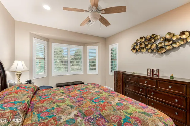 a bedroom with a bed and a dresser