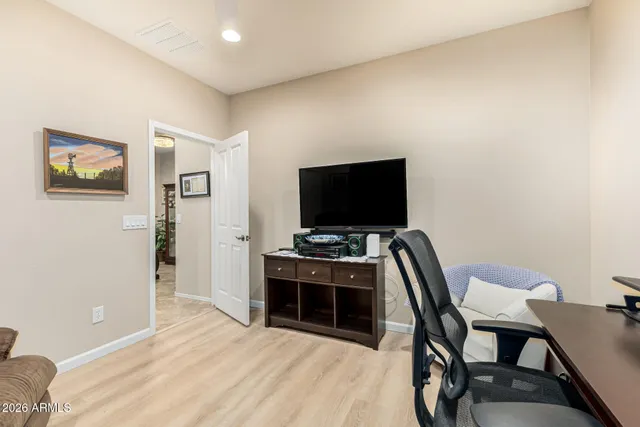 a view of a livingroom with furniture and flat screen tv