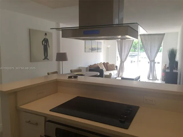 a kitchen with a sink and a window