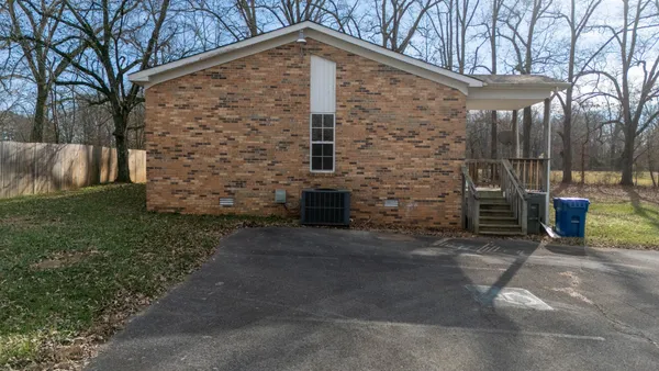 a brick building with a yard