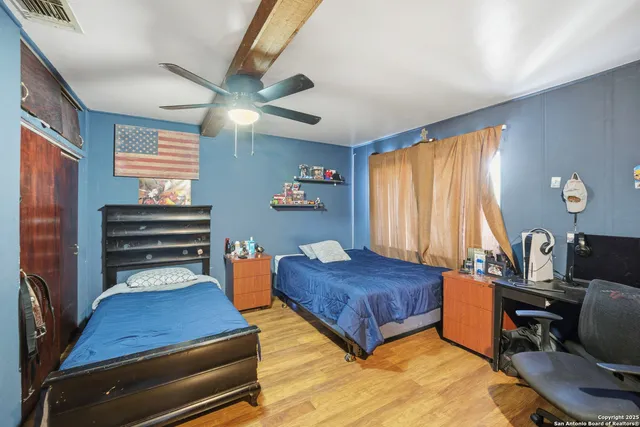 a bedroom with furniture and a window