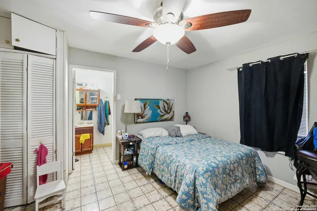 a bedroom with a bed and a walk in closet