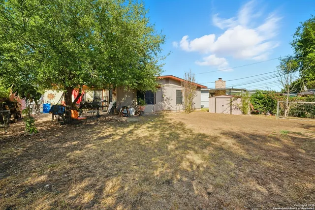 a view of a park with swings and slides