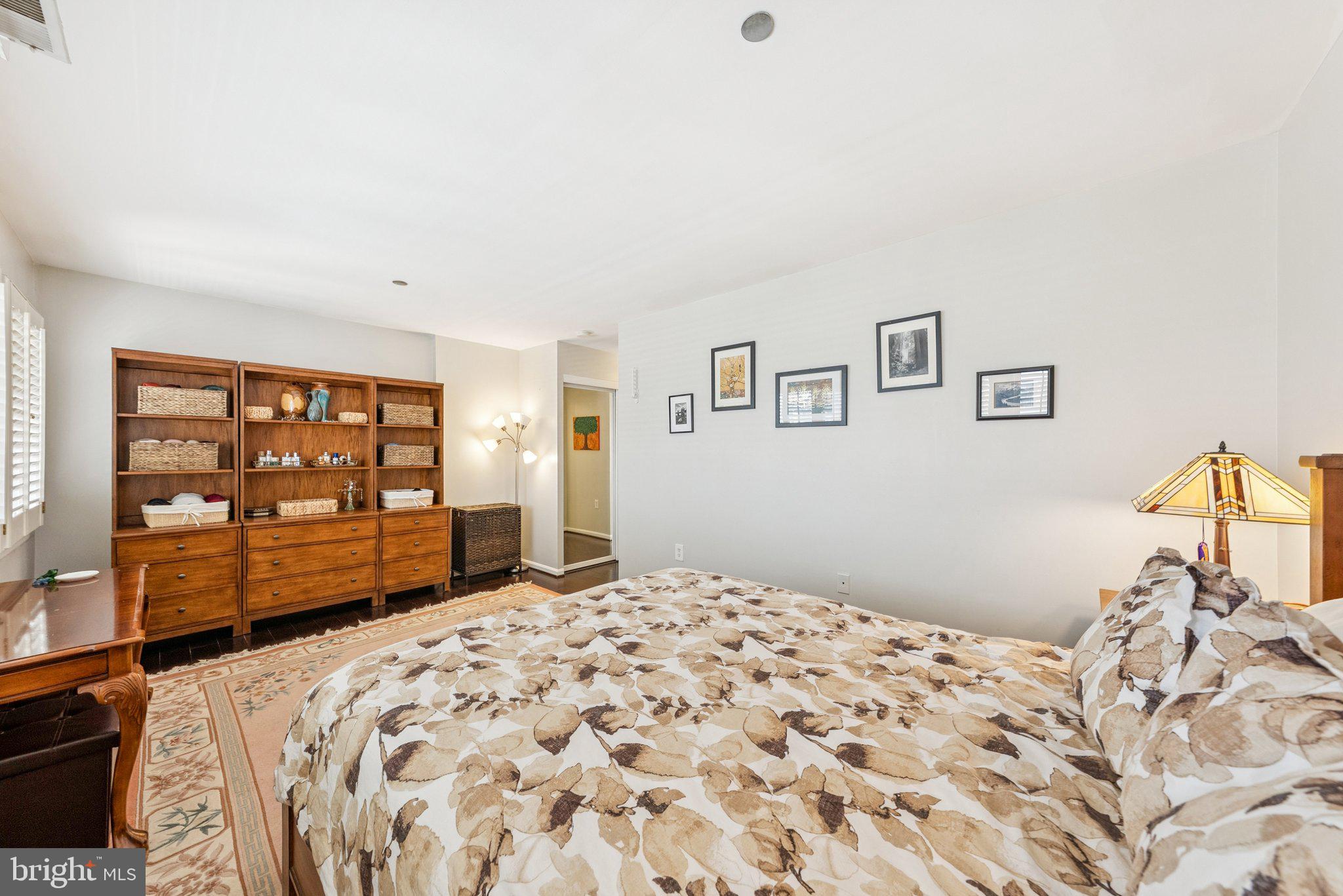1301 North Courthouse Road, Unit 1810 Arlington, VA 22201 - Photo 15 of 29 a bedroom with a bed and a dresser