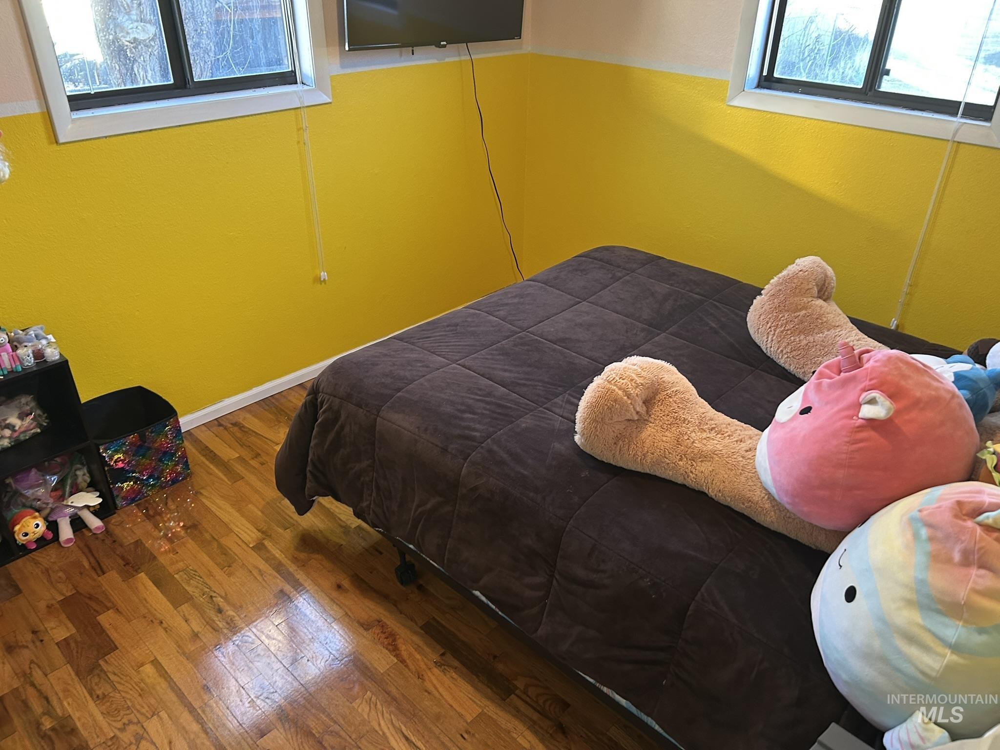 3731 16th Street Lewiston, ID 83501 - Photo 14 of 35 Bedroom with multiple windows and hardwood / wood-style flooring