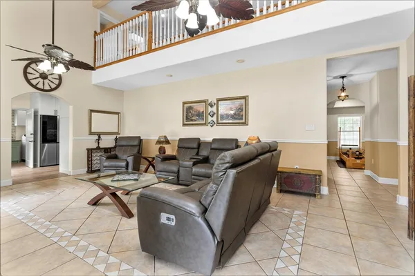 a view of a livingroom with furniture and a window