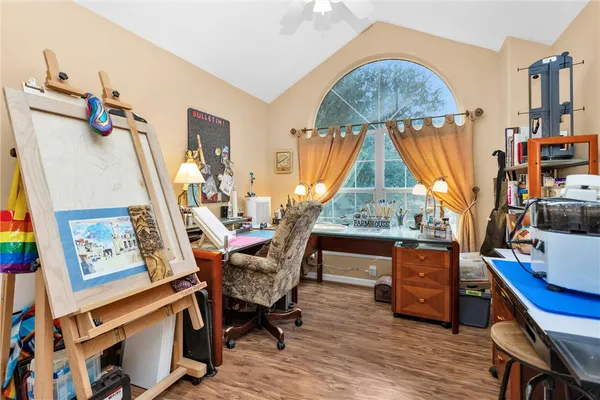 a view of room with furniture and wooden floor