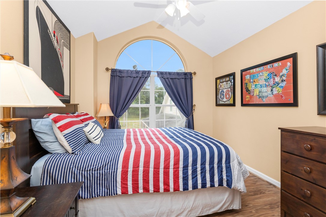 30820 Collier Smith Road Magnolia, TX 77354 - Photo 34 of 50 a bedroom with a bed and a painting on the wall