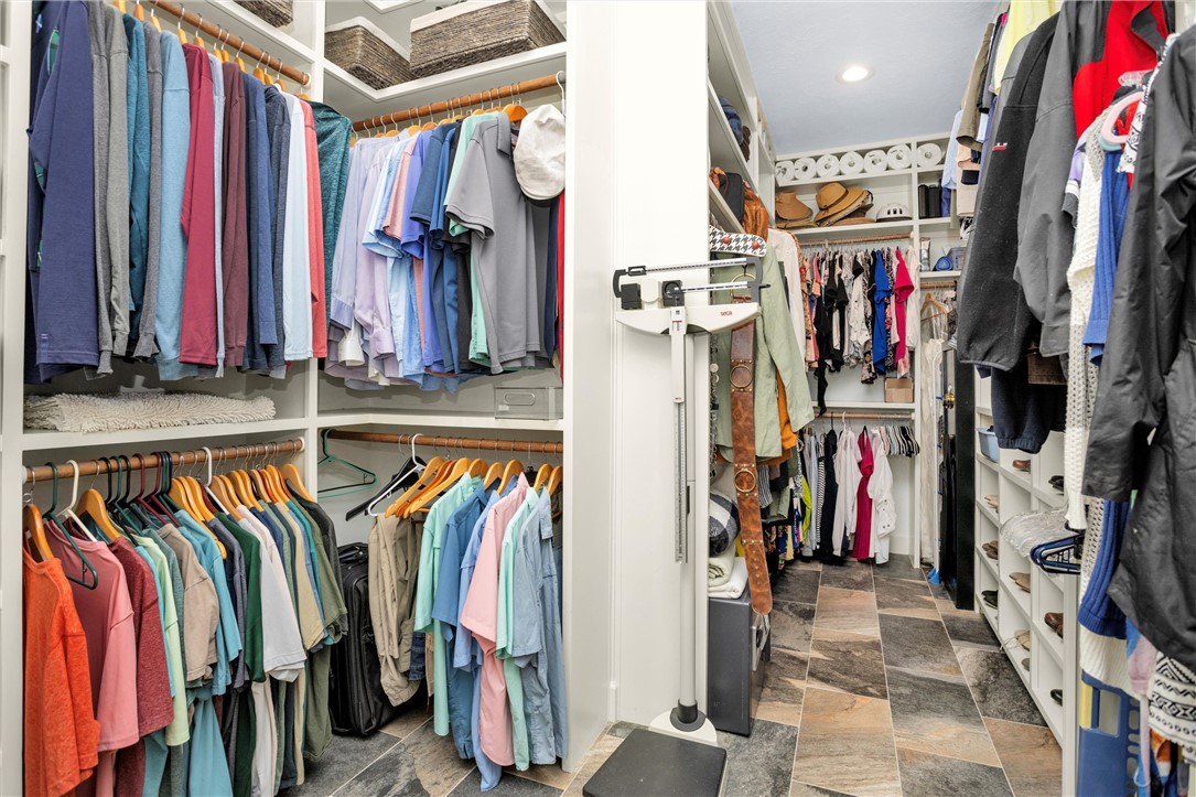 30820 Collier Smith Road Magnolia, TX 77354 - Photo 39 of 50 a view of walk in closet with clothes