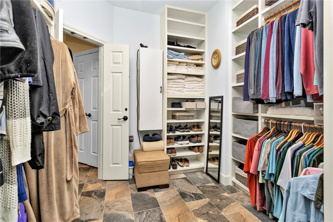 30820 Collier Smith Road Magnolia, TX 77354 - Photo 40 of 50 a view of walk in closet with clothes and shoes