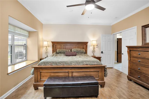 a view of a house with backyard sitting area and swimming pool