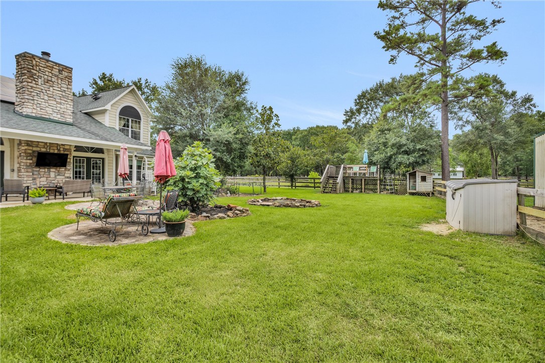 30820 Collier Smith Road Magnolia, TX 77354 - Photo 46 of 50 a view of a house with backyard porch and sitting area