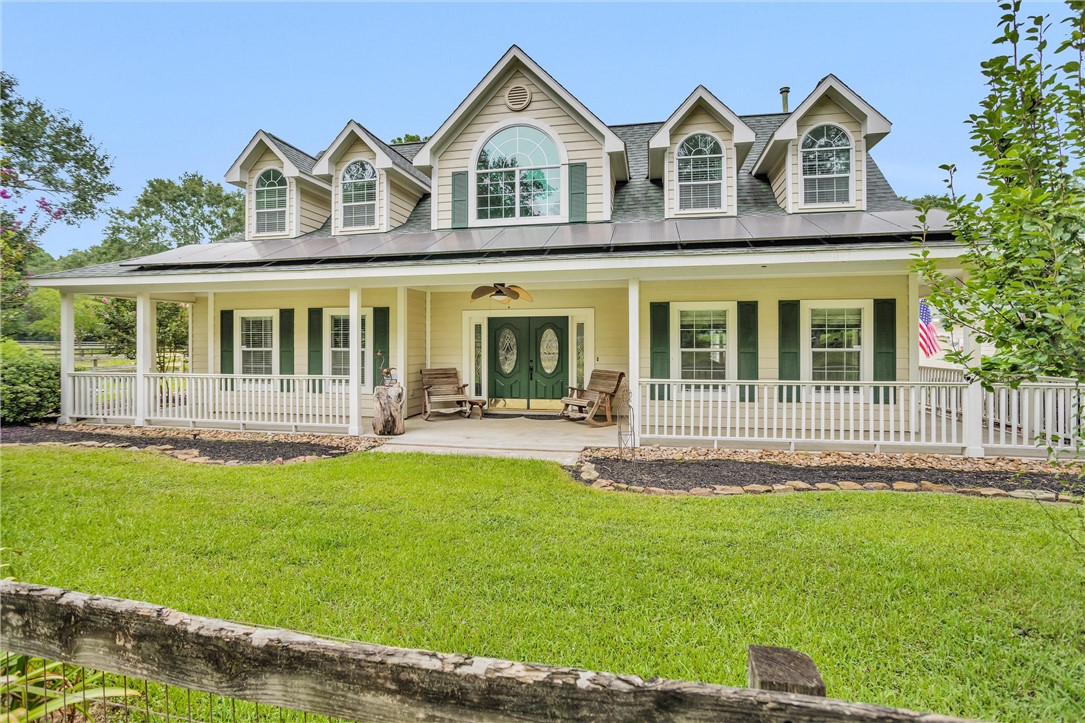 30820 Collier Smith Road Magnolia, TX 77354 - Photo 5 of 50 a front view of a house with a yard