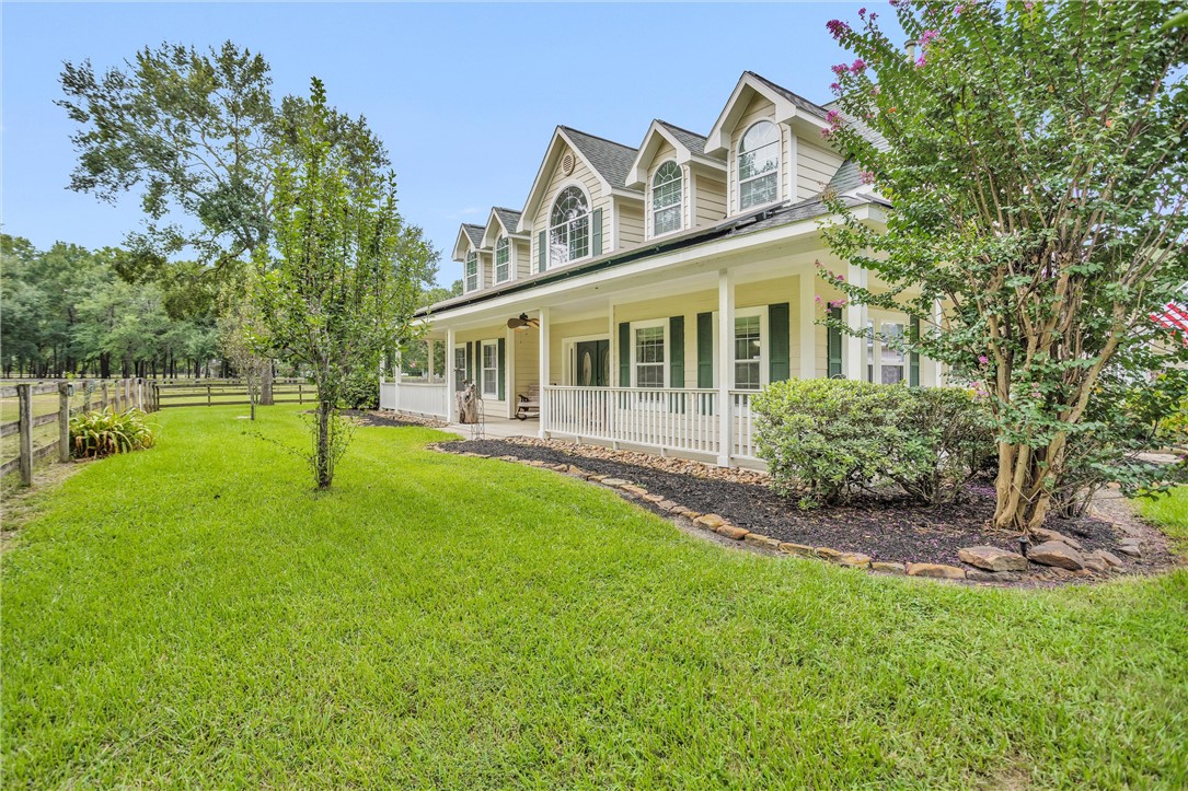30820 Collier Smith Road Magnolia, TX 77354 - Photo 6 of 50 a view of a house with backyard and a tree