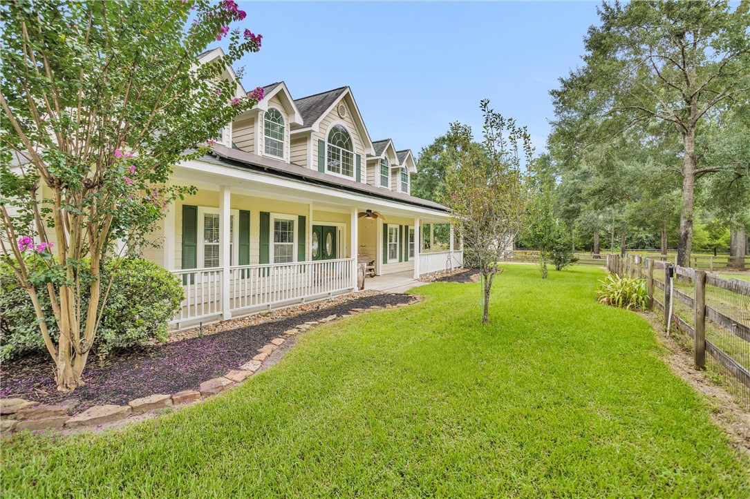 30820 Collier Smith Road Magnolia, TX 77354 - Photo 7 of 50 a house with swimming pool in front of it