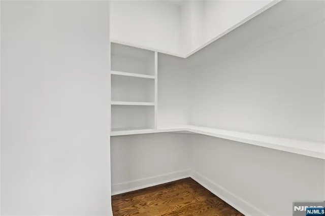 wooden floor in a room with a bathroom