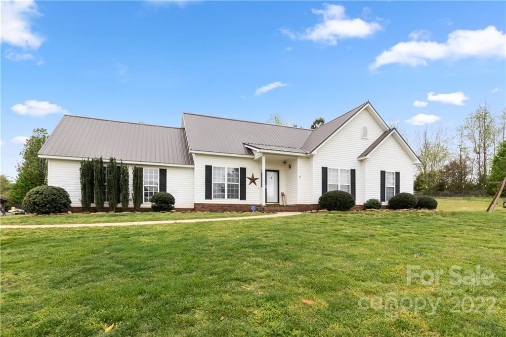 3505 Crow Burk Road Pageland, SC 29728 - Photo 2 of 30 a view of a house with a yard and sitting area
