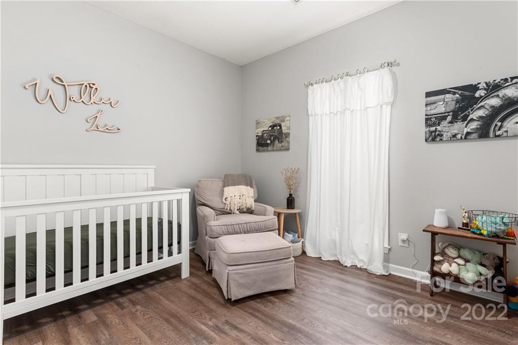 3505 Crow Burk Road Pageland, SC 29728 - Photo 21 of 30 a bedroom with furniture and wooden floor