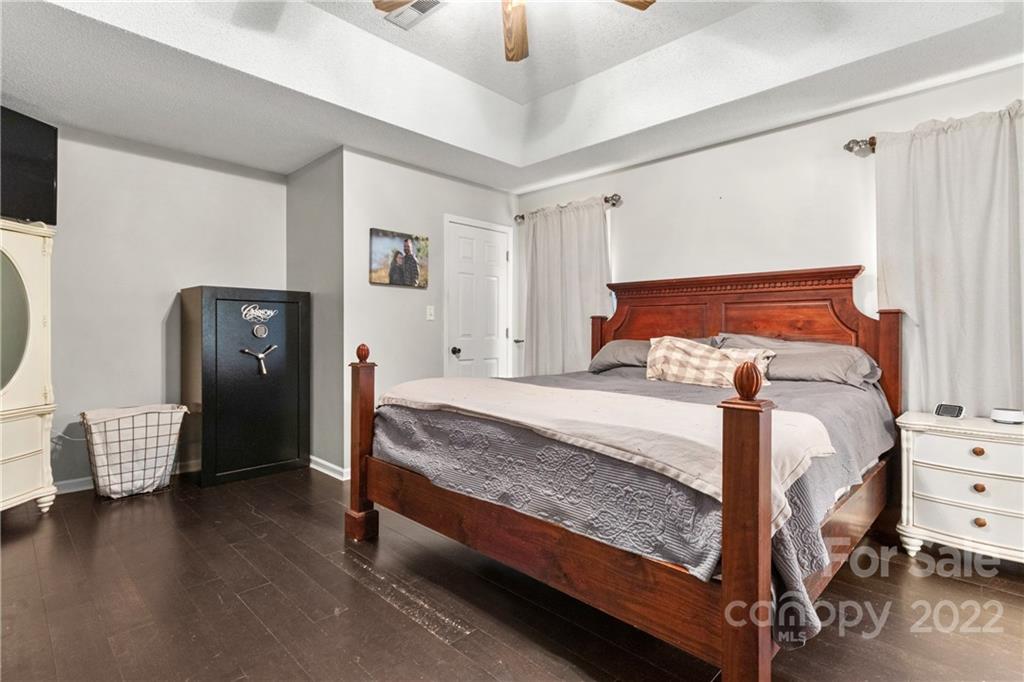 3505 Crow Burk Road Pageland, SC 29728 - Photo 25 of 30 a bedroom with a bed and wooden floor