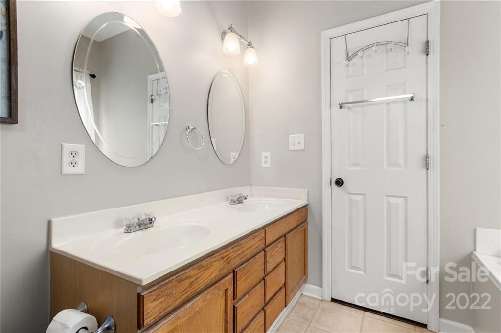 3505 Crow Burk Road Pageland, SC 29728 - Photo 27 of 30 a bathroom with a sink and a mirror