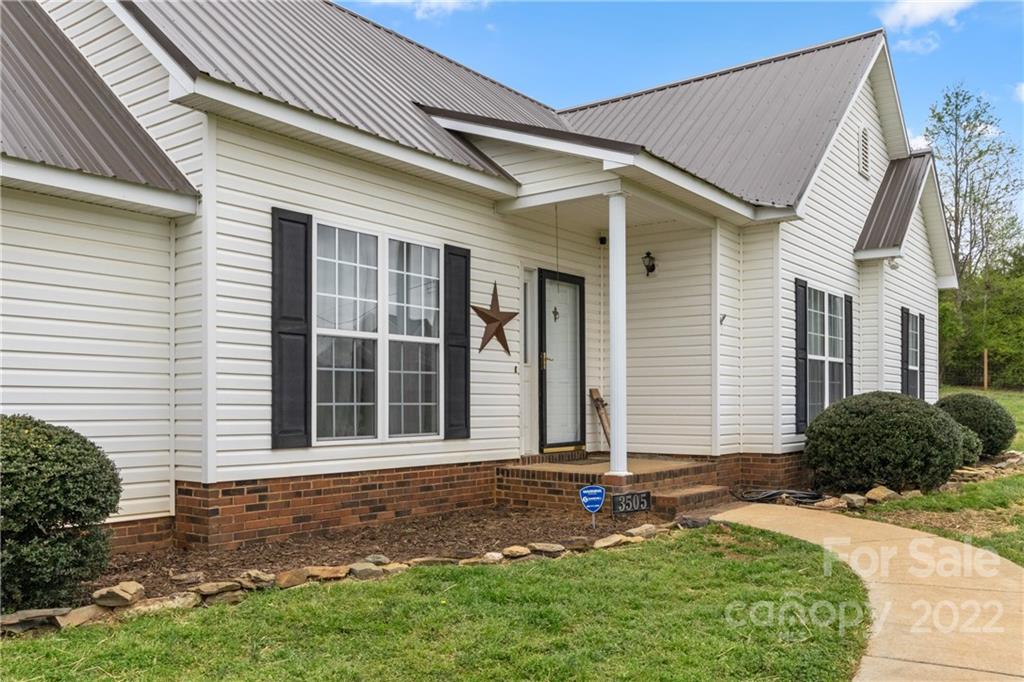 3505 Crow Burk Road Pageland, SC 29728 - Photo 3 of 30 a front view of a house with garden