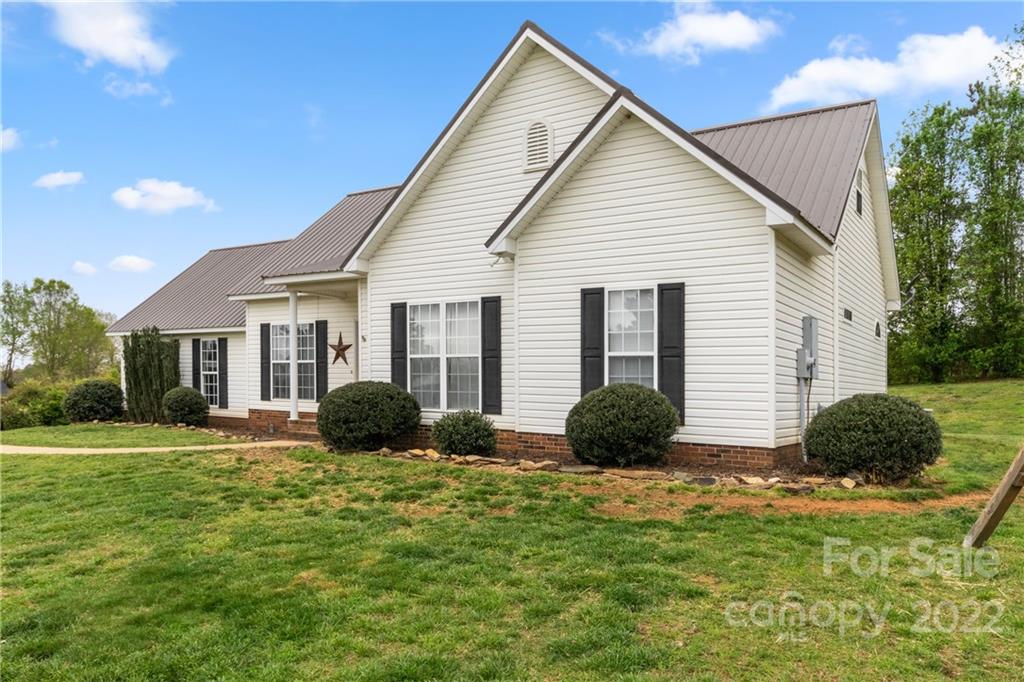 3505 Crow Burk Road Pageland, SC 29728 - Photo 4 of 30 a view of a house with a yard and plants