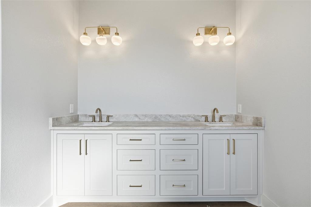 348 Lacek Mill Road China Spring, TX 76633 - Photo 26 of 40 a bathroom with cabinets a sink and dishwasher