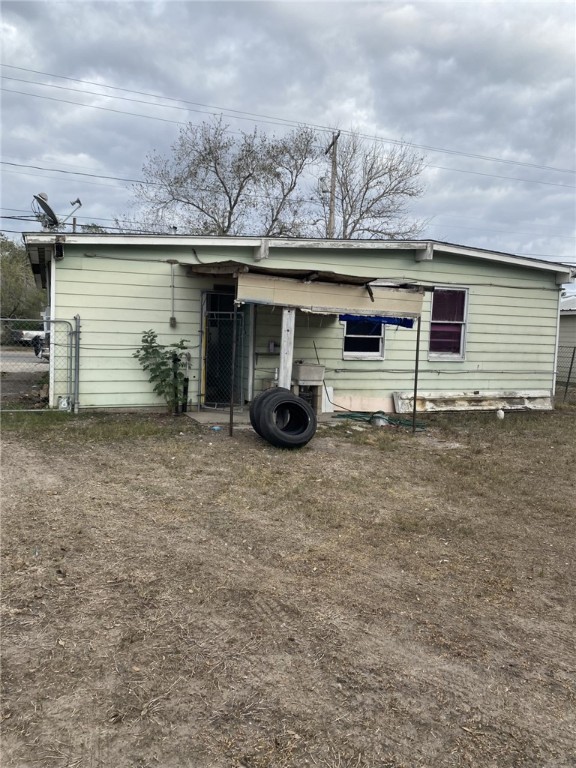 1100 South Cameron Street Alice, TX 78332 - Photo 17 of 18 front view of a house with a patio