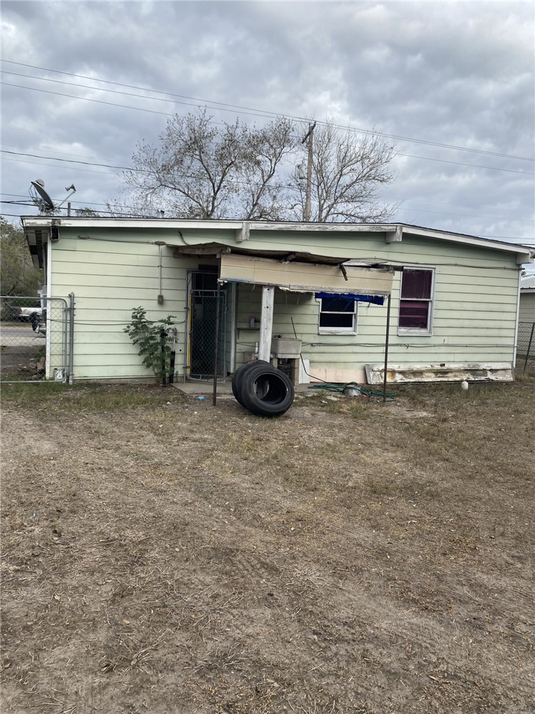 1100 South Cameron Street Alice, TX 78332 - Photo 17 of 18 front view of a house with a patio