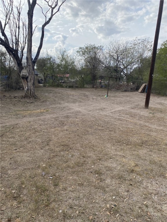 1100 South Cameron Street Alice, TX 78332 - Photo 18 of 18 a backyard of a house with lots of green space