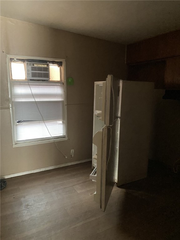 1100 South Cameron Street Alice, TX 78332 - Photo 5 of 18 an empty room with a fireplace and windows