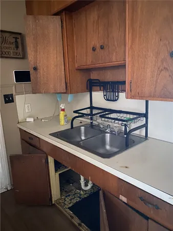 a kitchen with a sink and cabinets