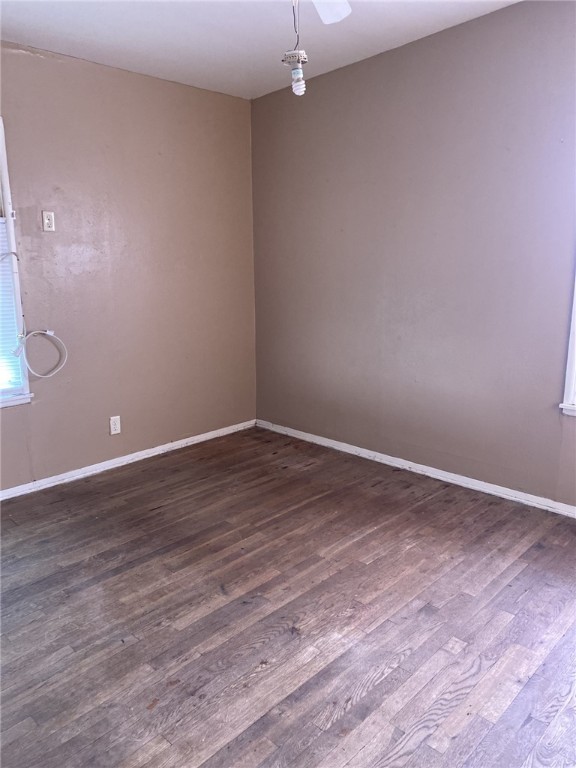 1100 South Cameron Street Alice, TX 78332 - Photo 10 of 18 a view of an empty room with wooden floor